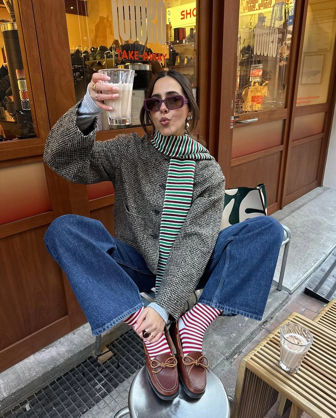 Gray sweater with wide jeans, striped socks and loafers