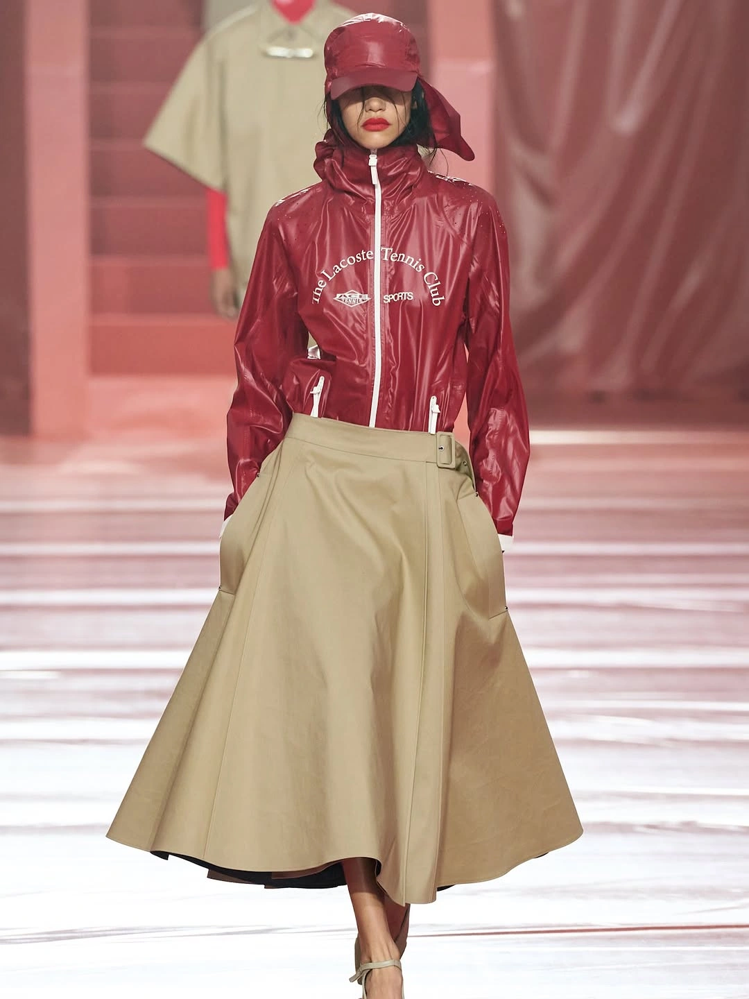 Glossy red sport jacket with beige wrap skirt