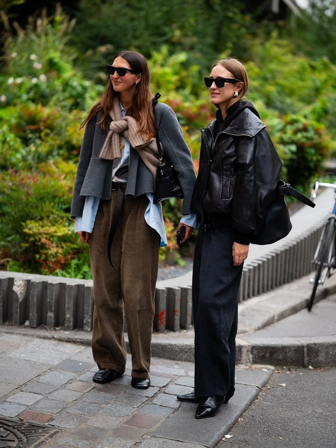 Two loose layered outfits with knit and black leather