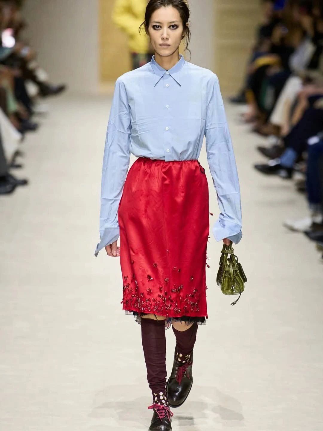 Blue button shirt with red embroidered skirt and burgundy legwear