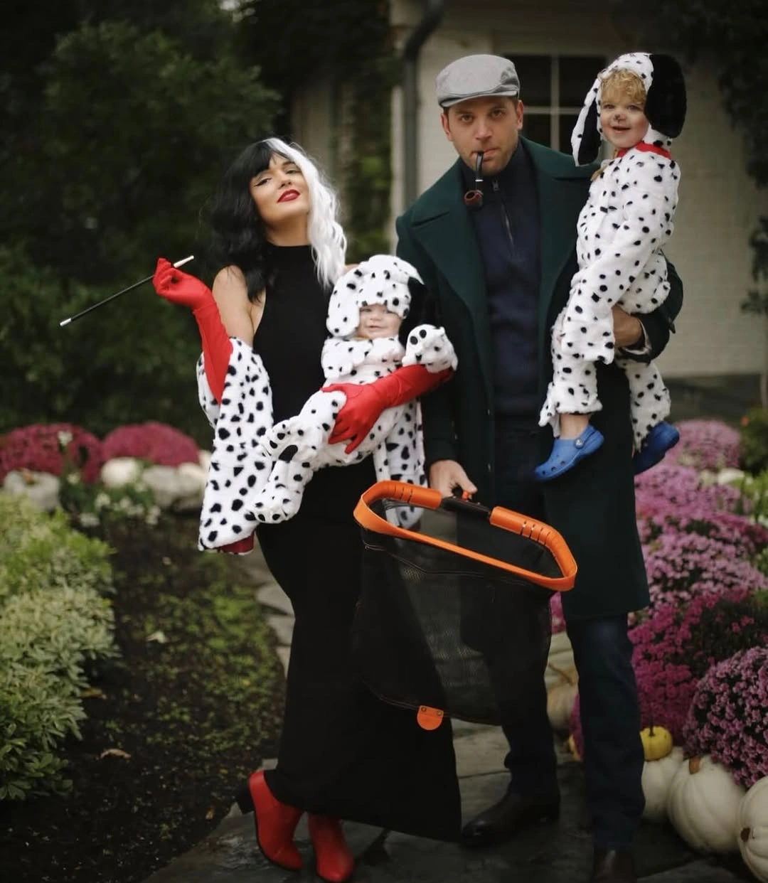 Black-and-white spotted family Halloween costume with red accents