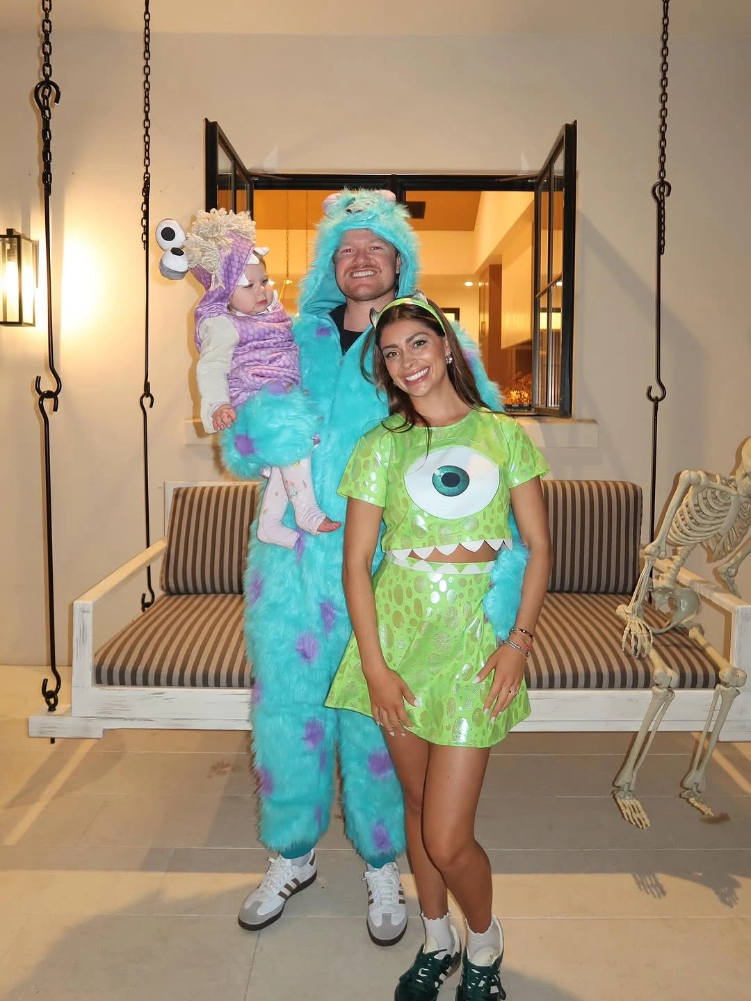 Bright green family costume with blue fuzzy and purple accents