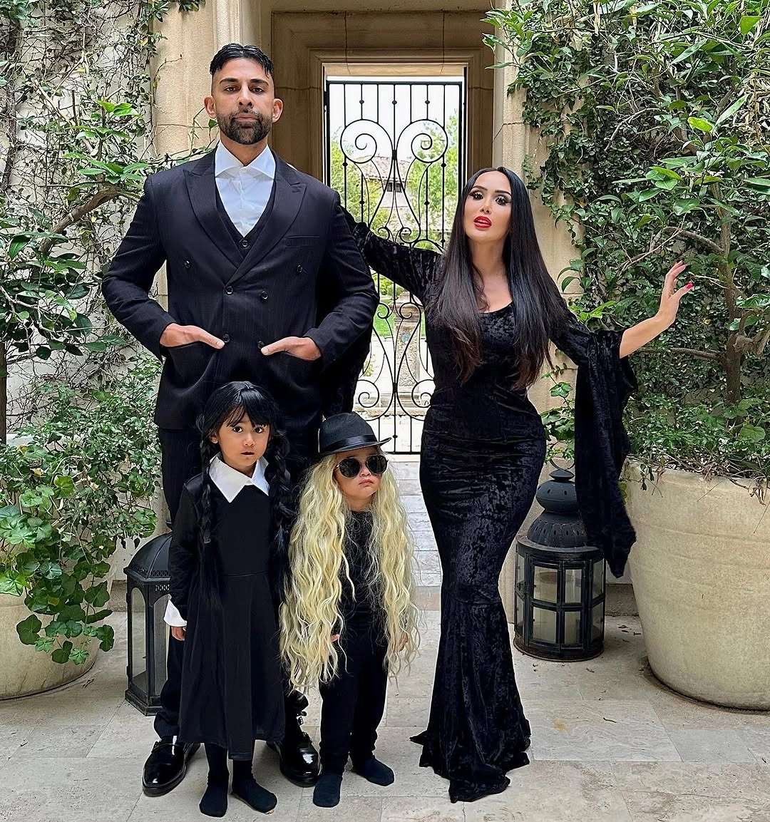 Formal black family costumes with pale child accents