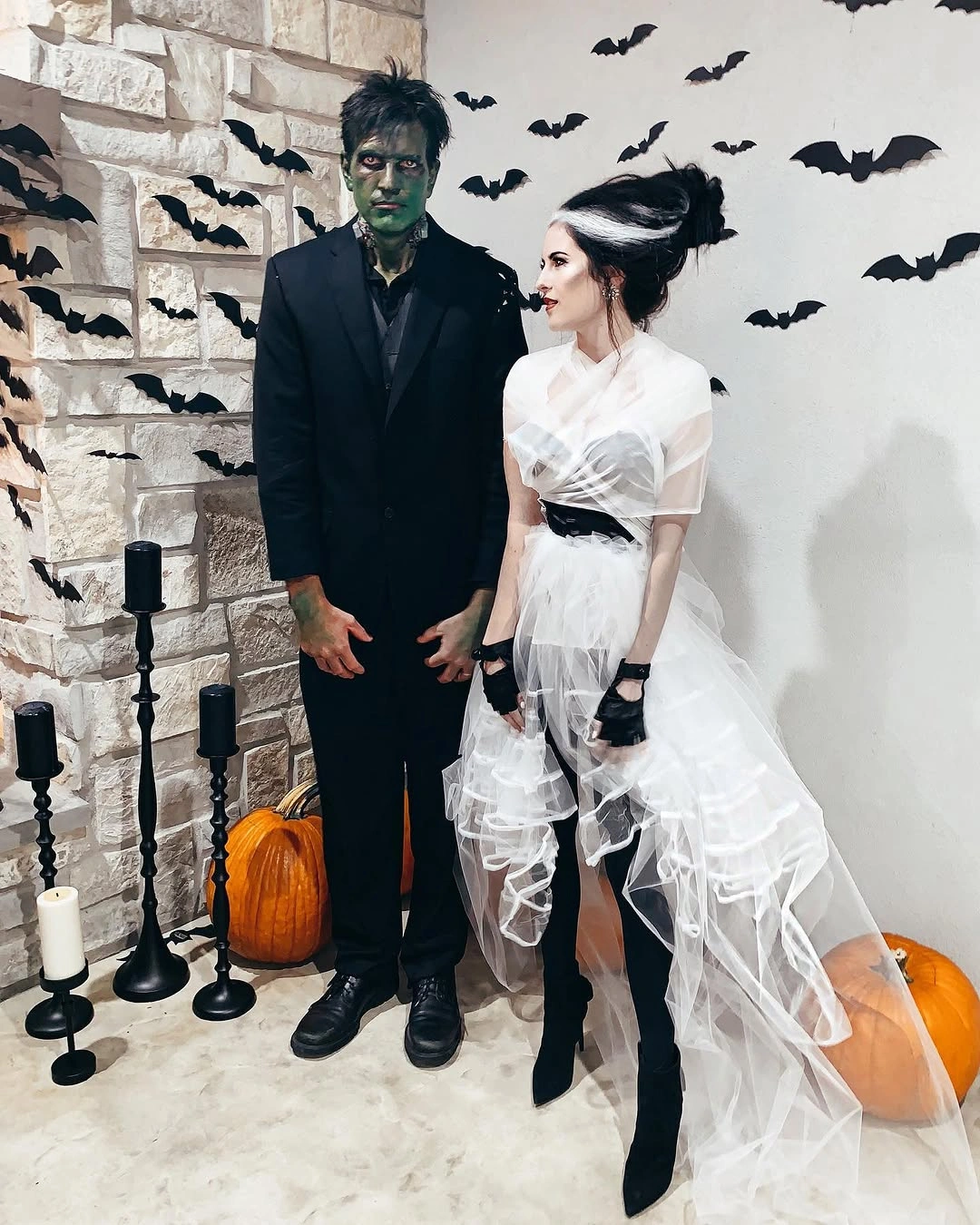 Black suit beside a tiered white Halloween dress