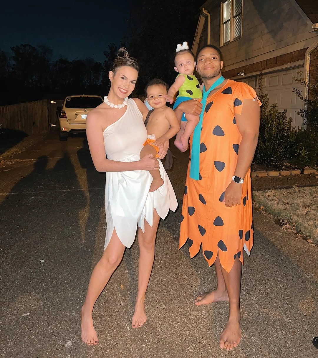 Orange and black family Halloween costumes with baby detail