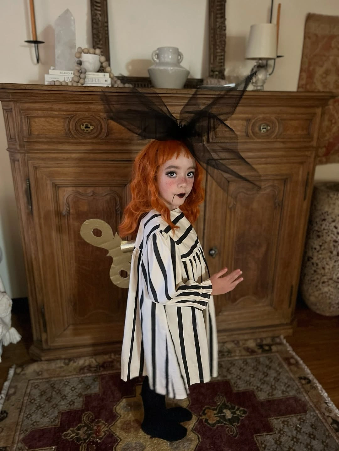 Black and white striped girls costume with pointed hat