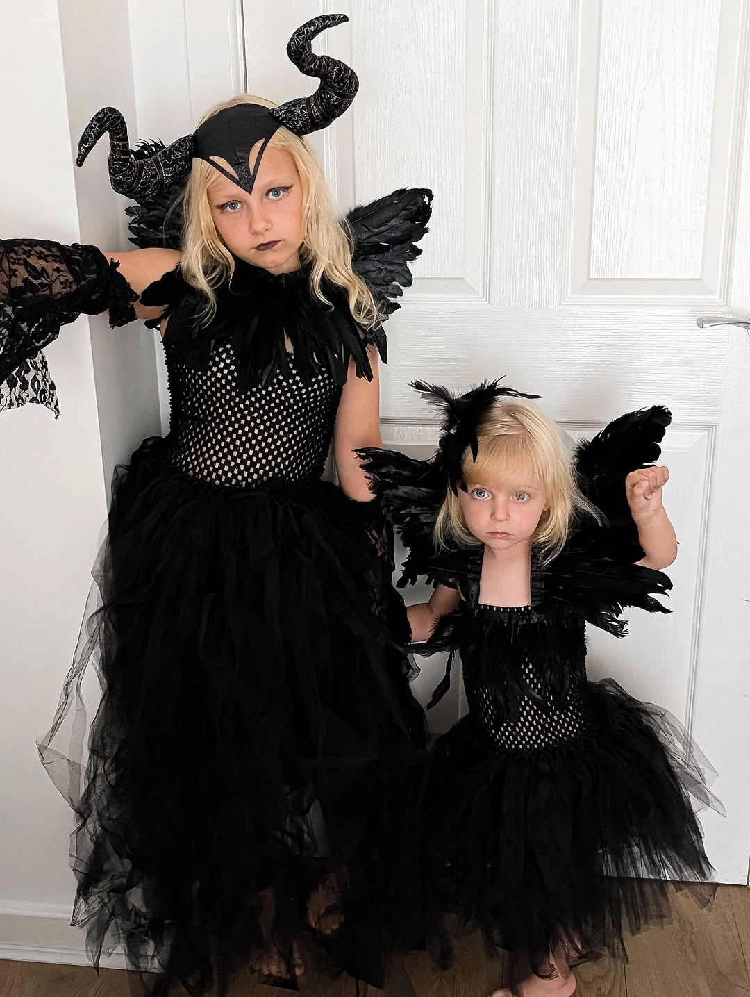 Black winged dresses with scaled accessories for girls
