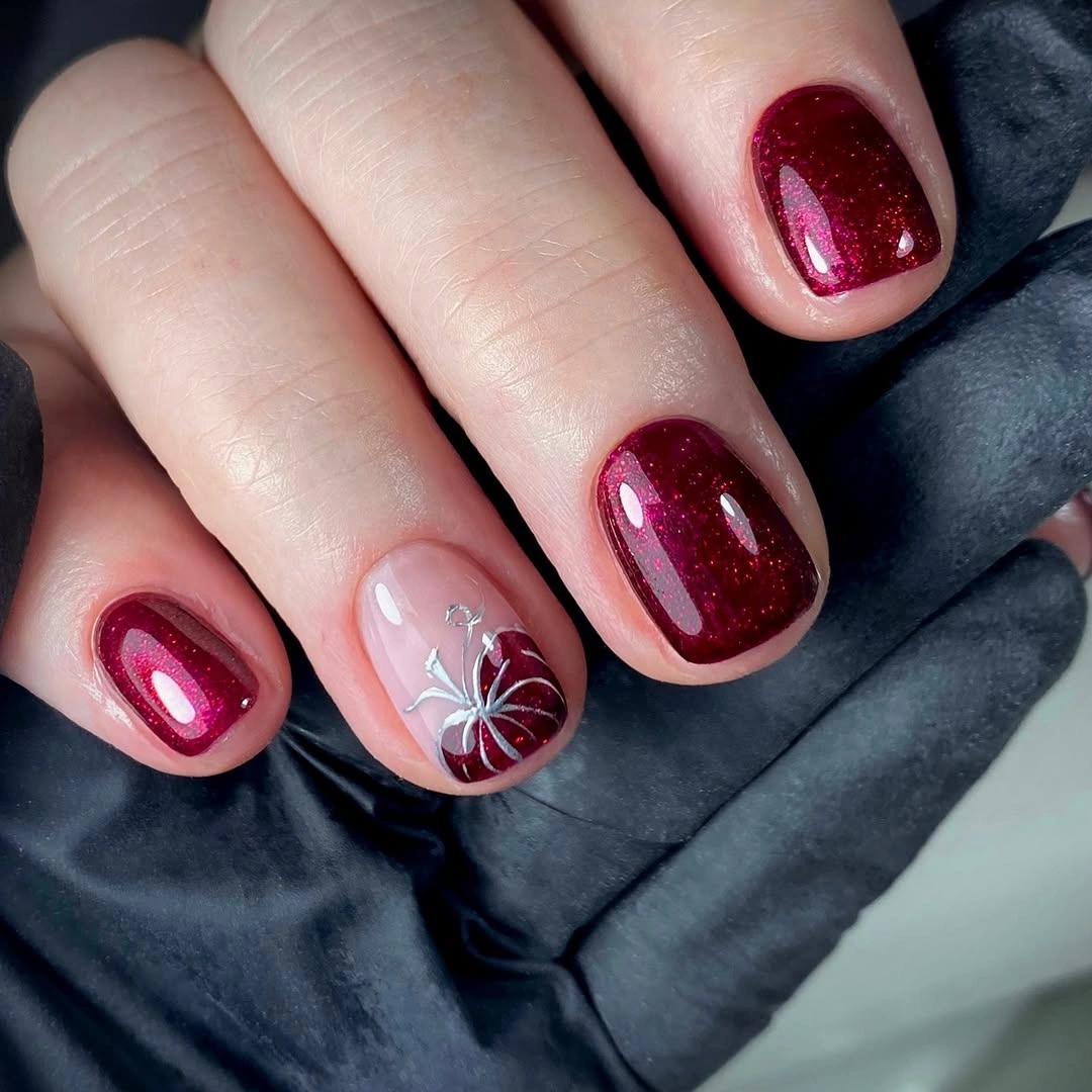 Burgundy rounded nails with pale web accent