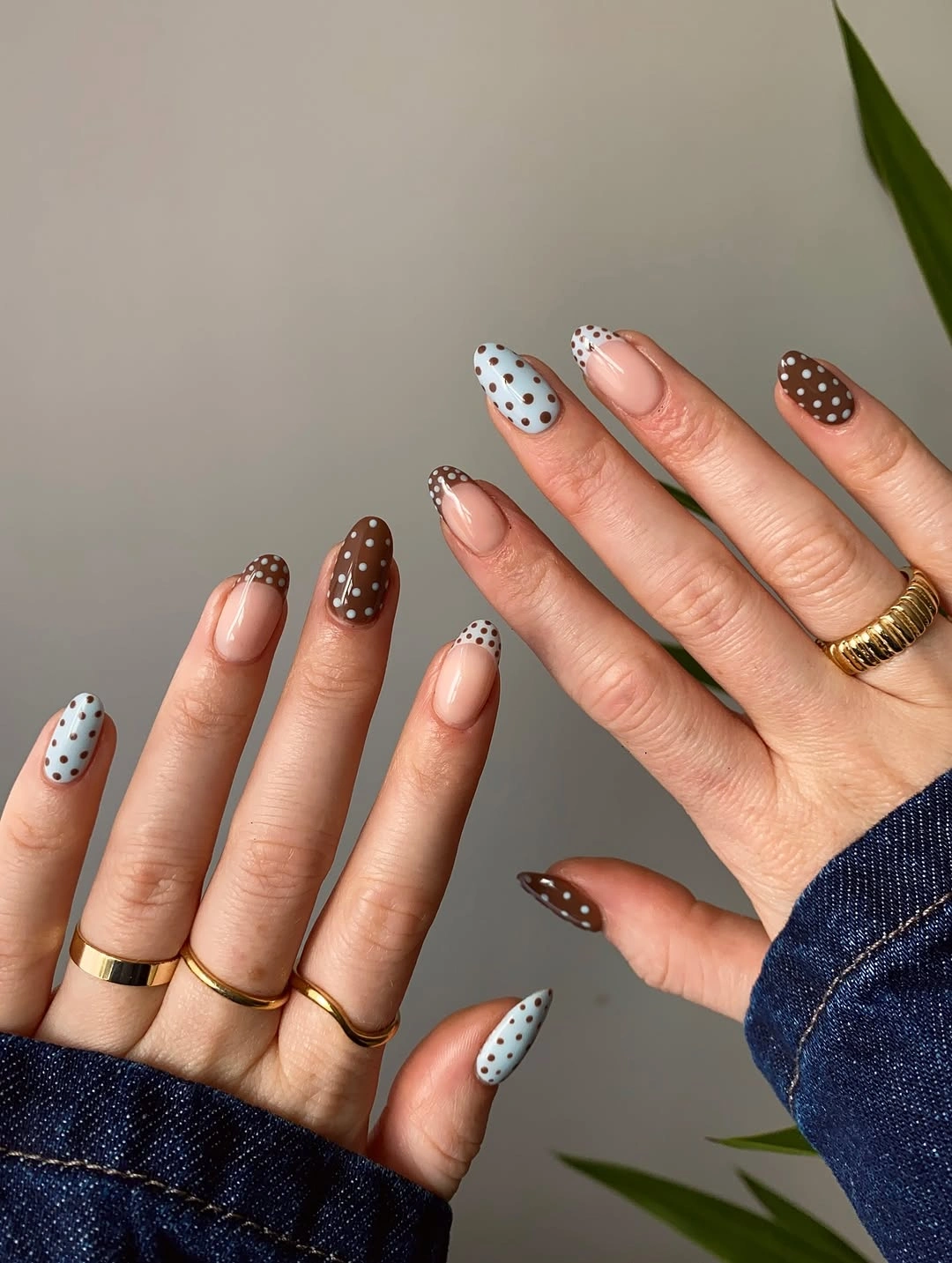 Long almond nails with blue brown dots and dotted tips