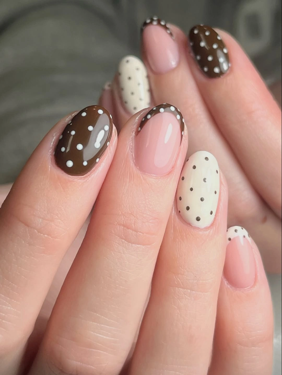 Brown cream and pink rounded nails with mixed dot placement