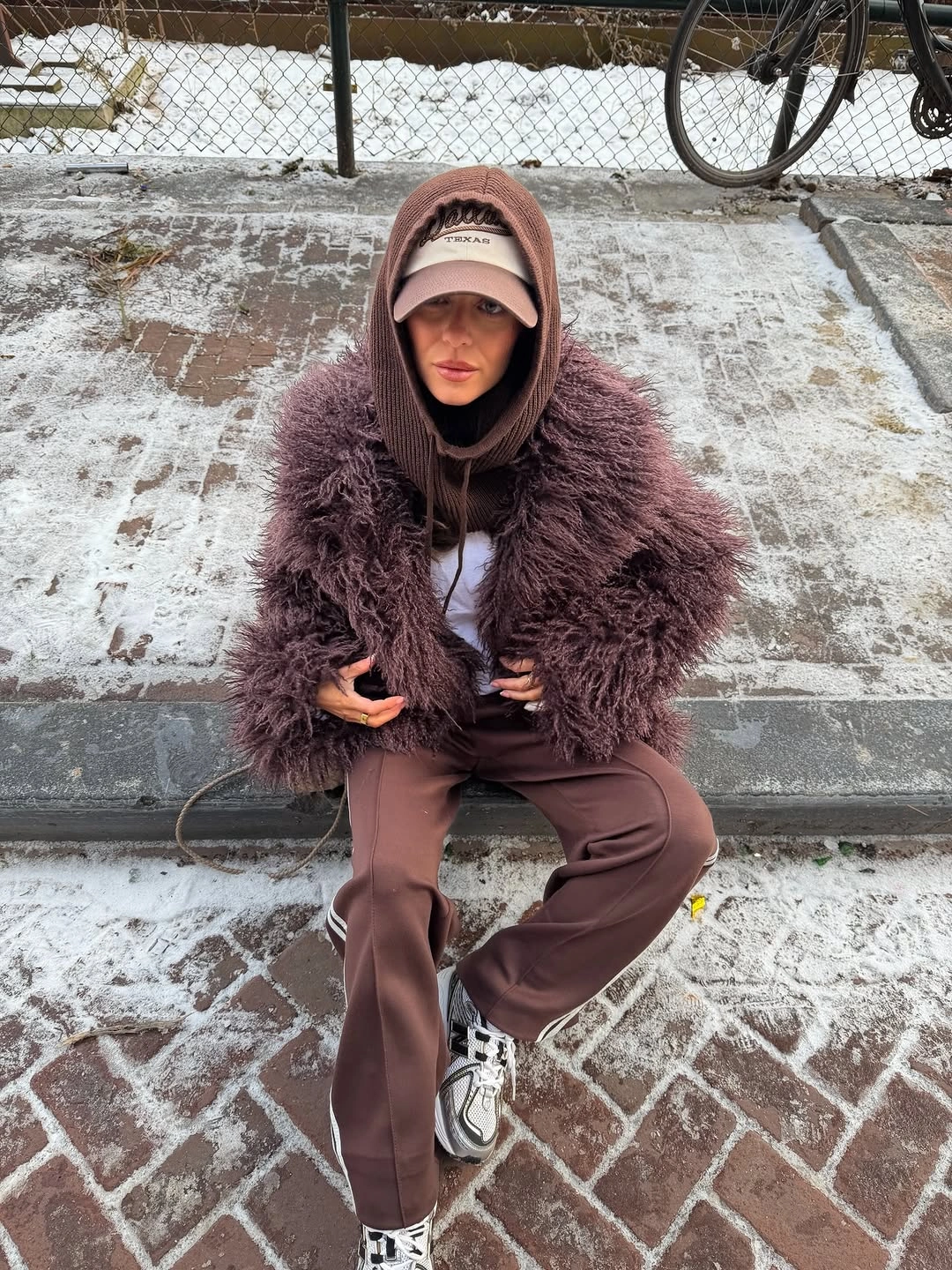 Brown textured jacket with hood and wide trousers