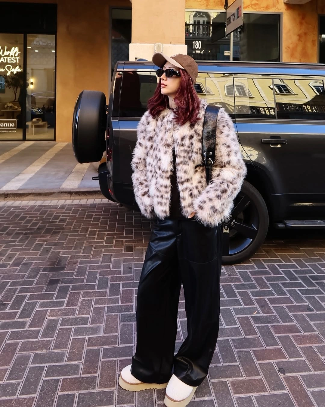 Spotted light jacket with wide black trousers and platform sneakers