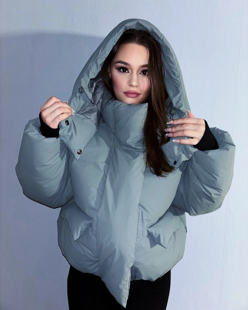 Icy blue oversized hooded puffer with black lower layer