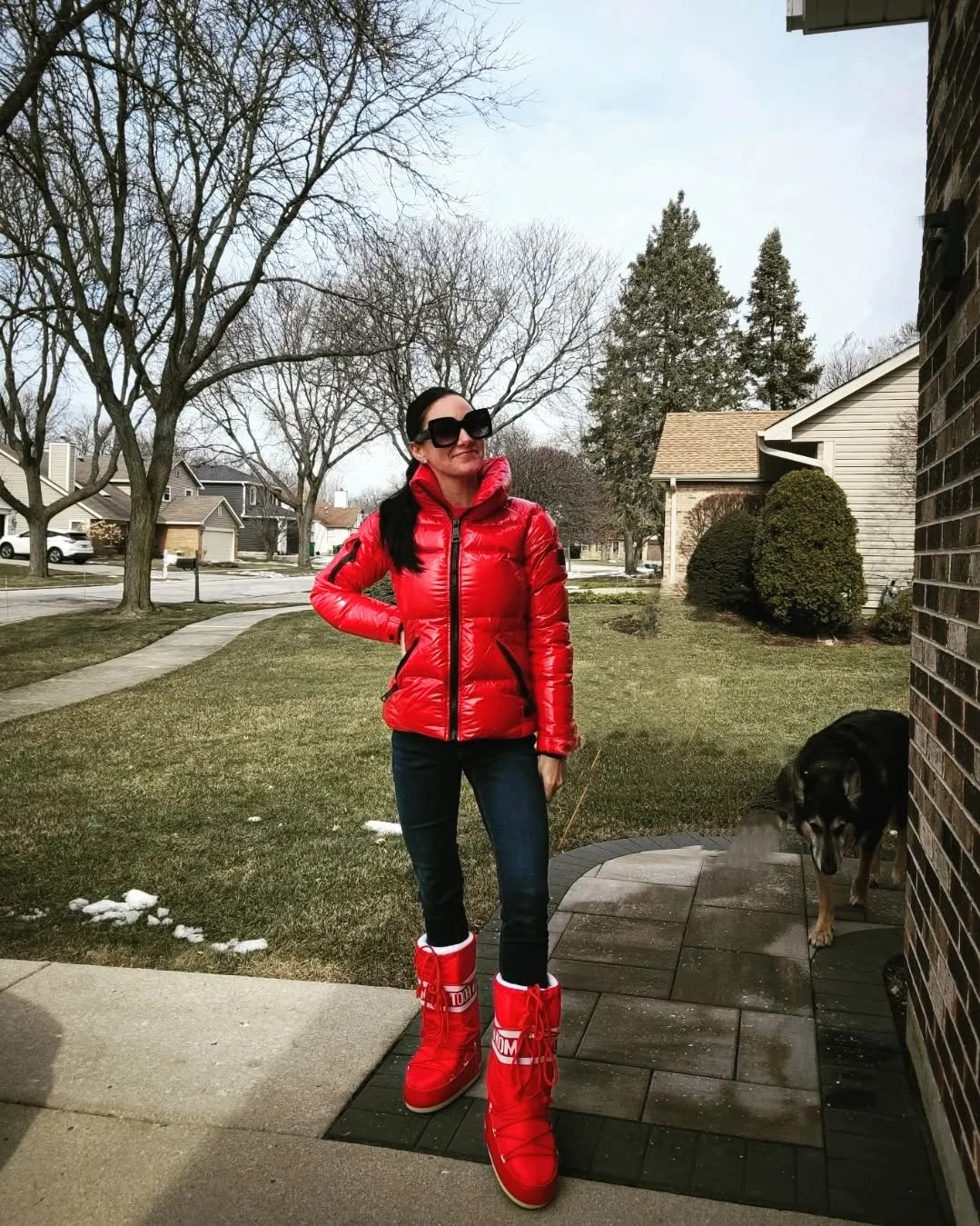 Red glossy puffer jacket with matching red winter boots