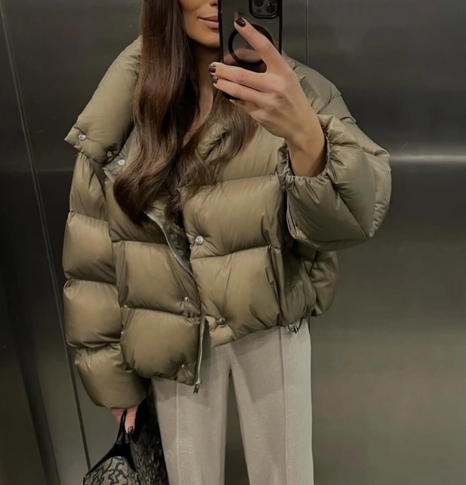 Muted taupe puffer with pale wide trousers and black bag