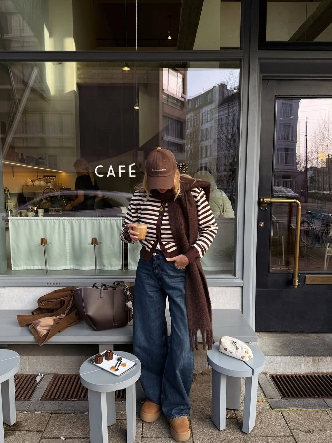Brown striped top with dark jeans, scarf and tan shoes