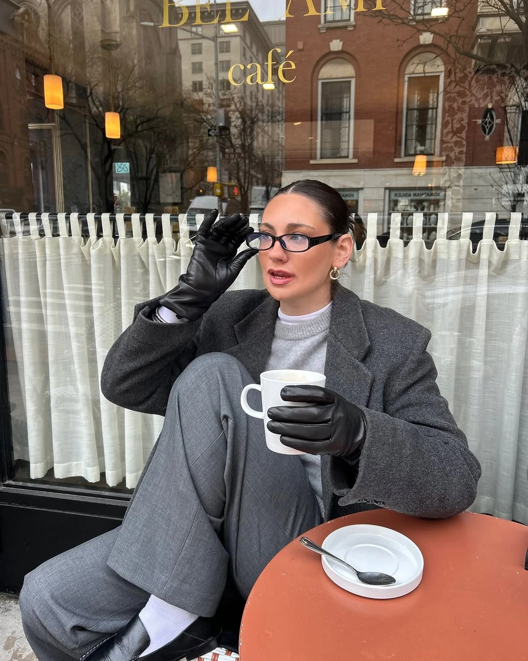 Charcoal tailored layer with gray trousers, gloves and black shoes