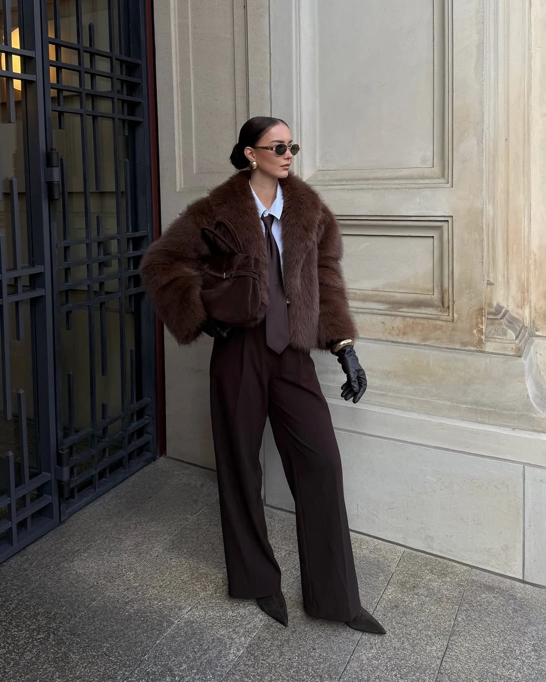 Fuzzy brown jacket with shirt, tie and dark wide trousers