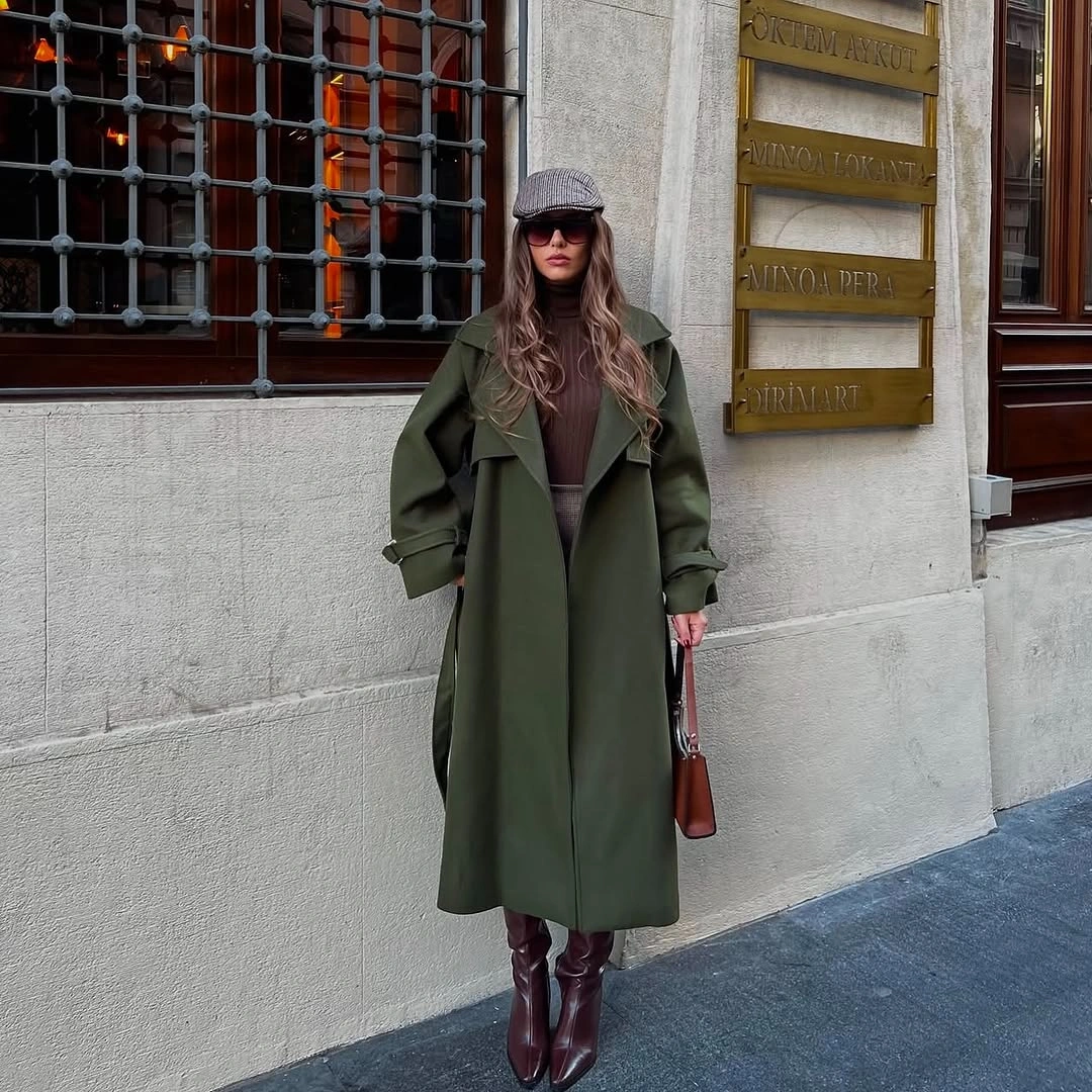 Long olive coat with brown layers and burgundy-brown boots