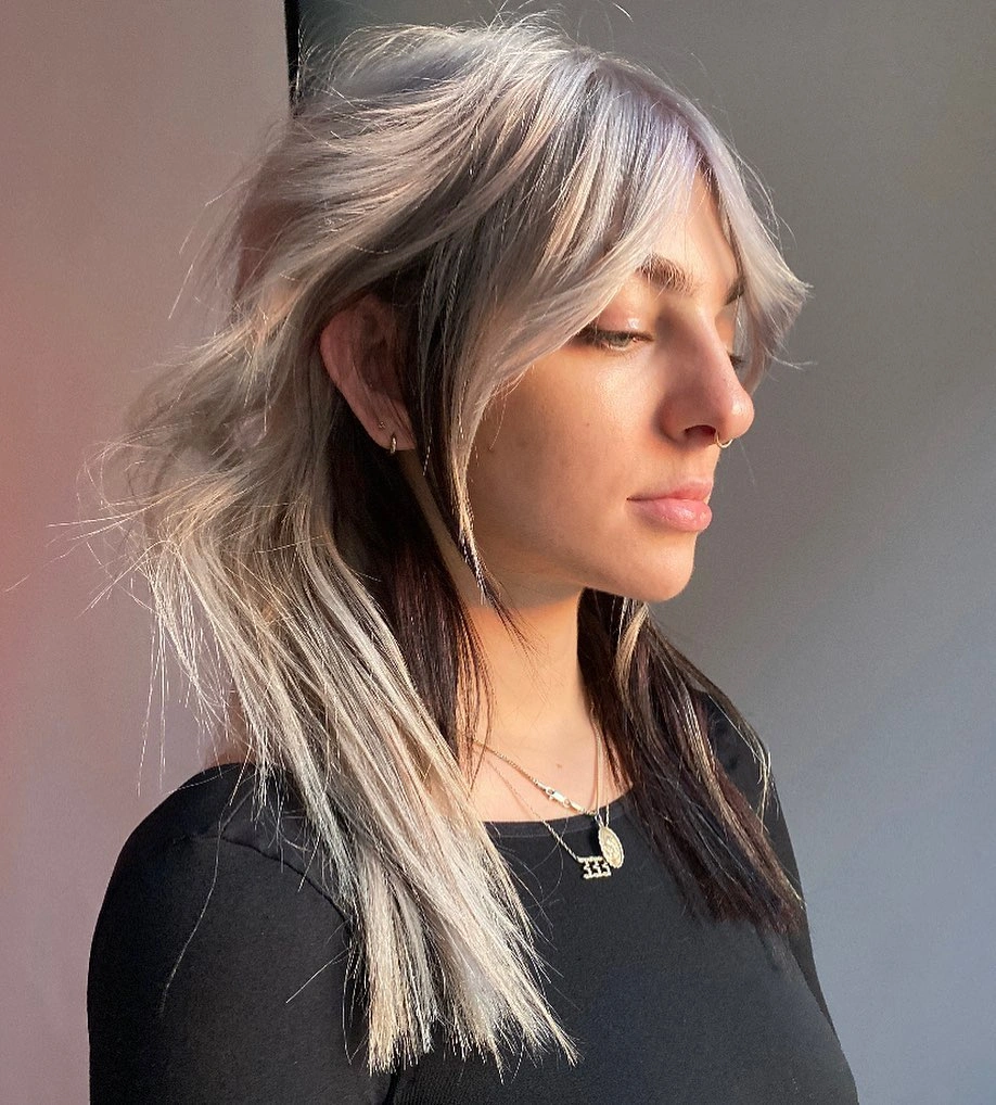 Long cool beige blonde hair with smoky roots
