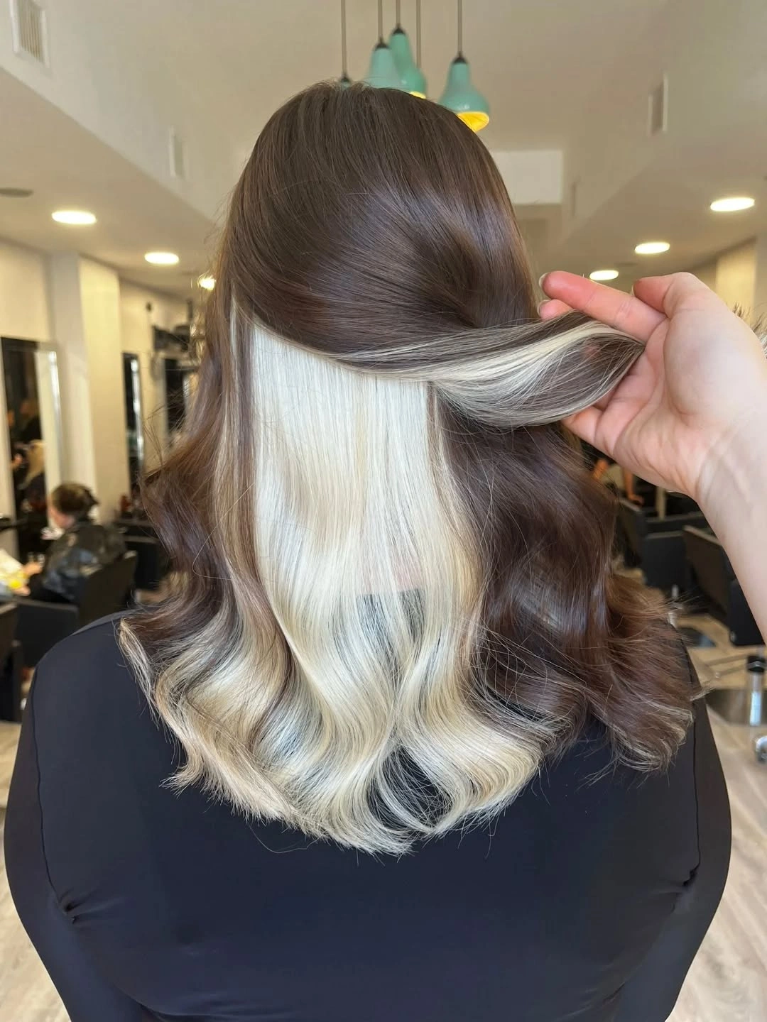 Medium brown waves lifted to reveal platinum underlayer