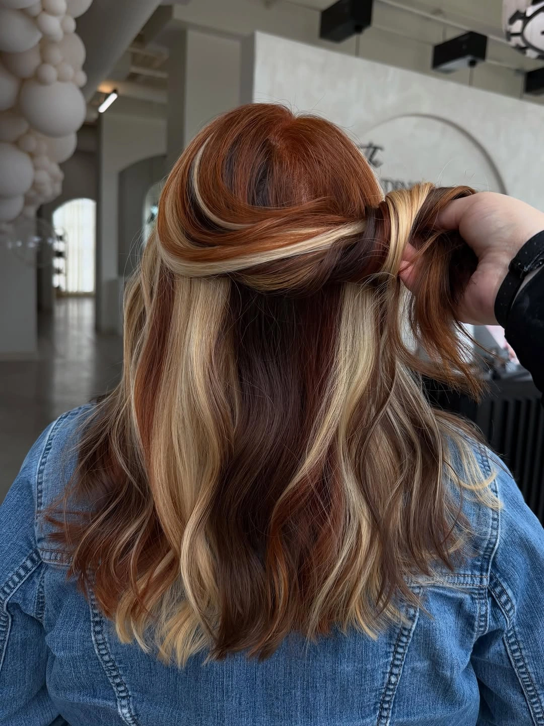 Half up chestnut waves with pale blonde ribbon