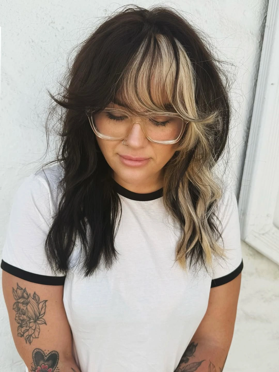 Long dark waves with one chunky blonde front streak