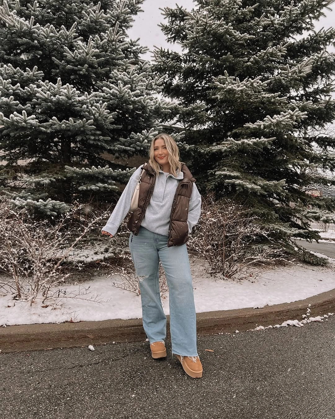 Taupe quilted vest with gray sweater and pale jeans