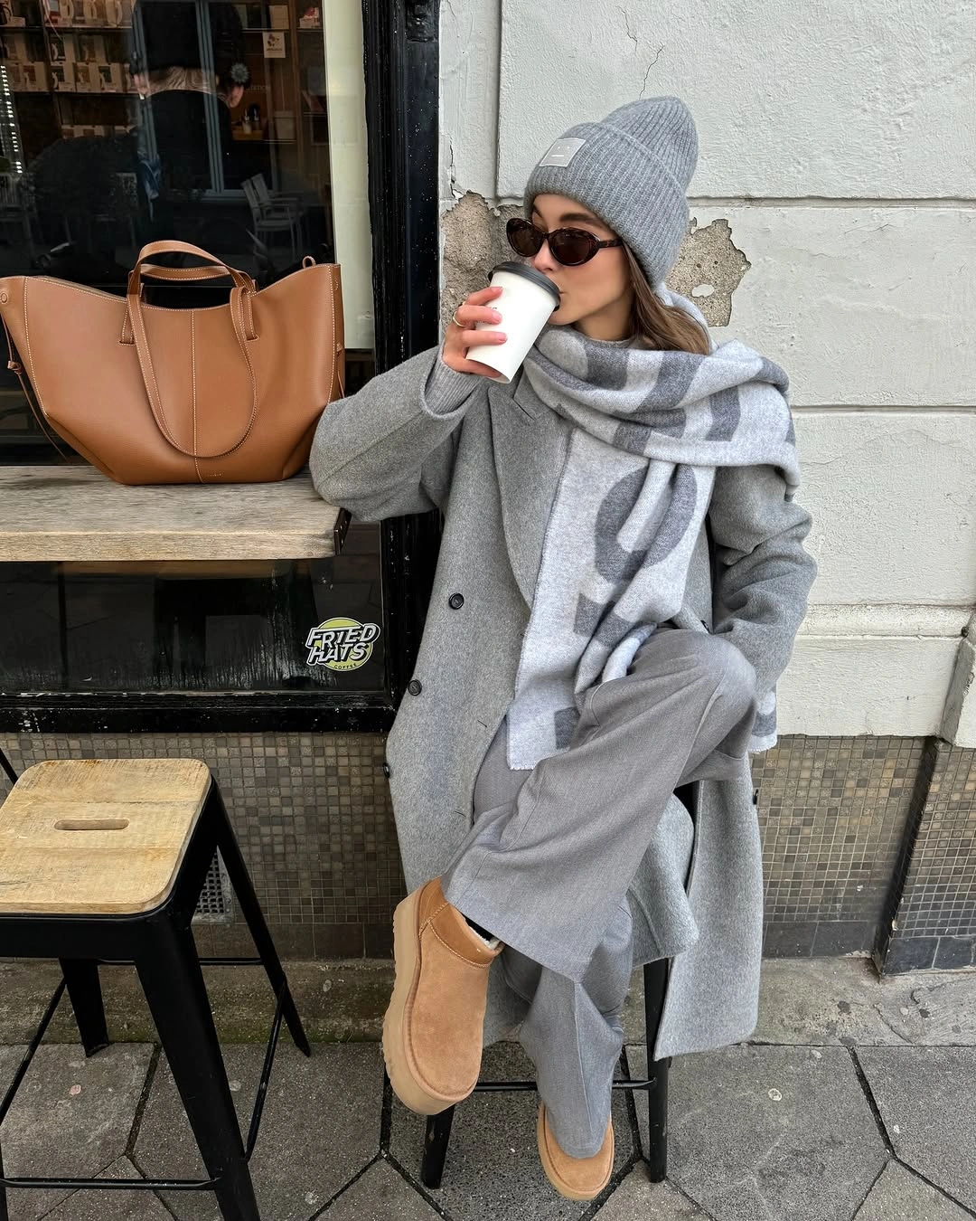 Gray coat with oversized plaid scarf and jeans