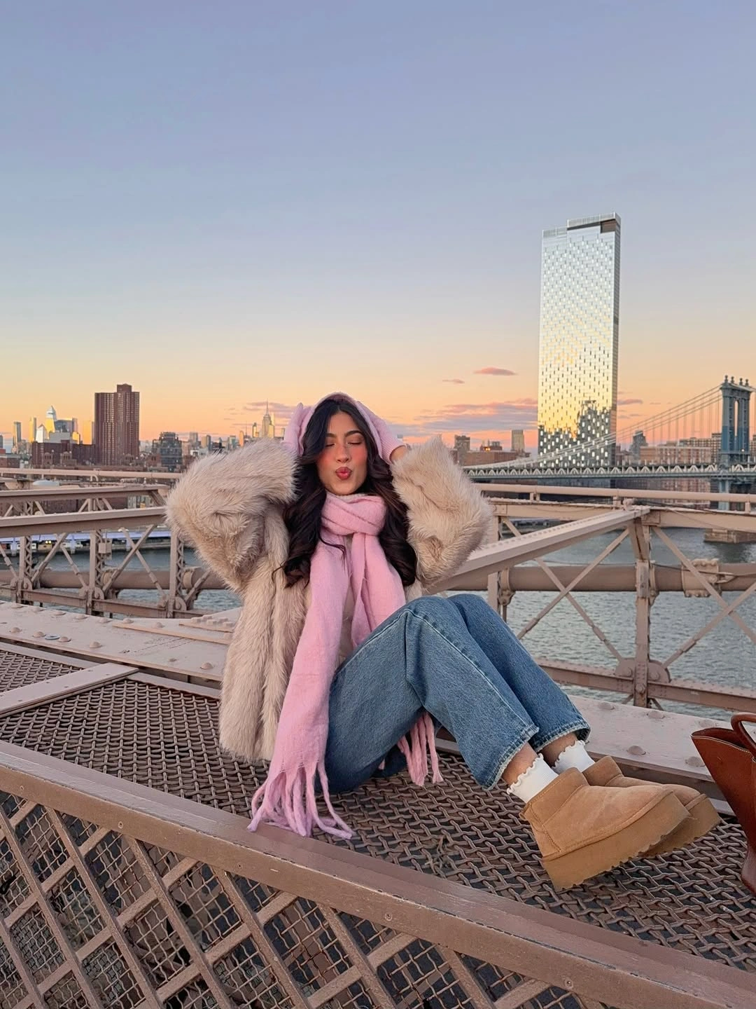 Cream plush jacket with pink scarf, jeans and tan platform boots