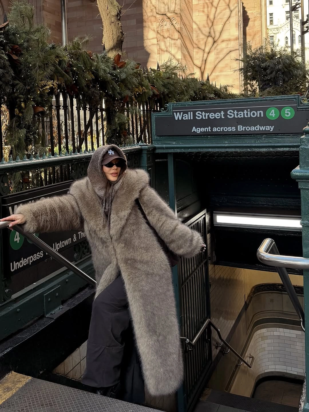 Long shaggy gray coat with hood, cap and dark pants