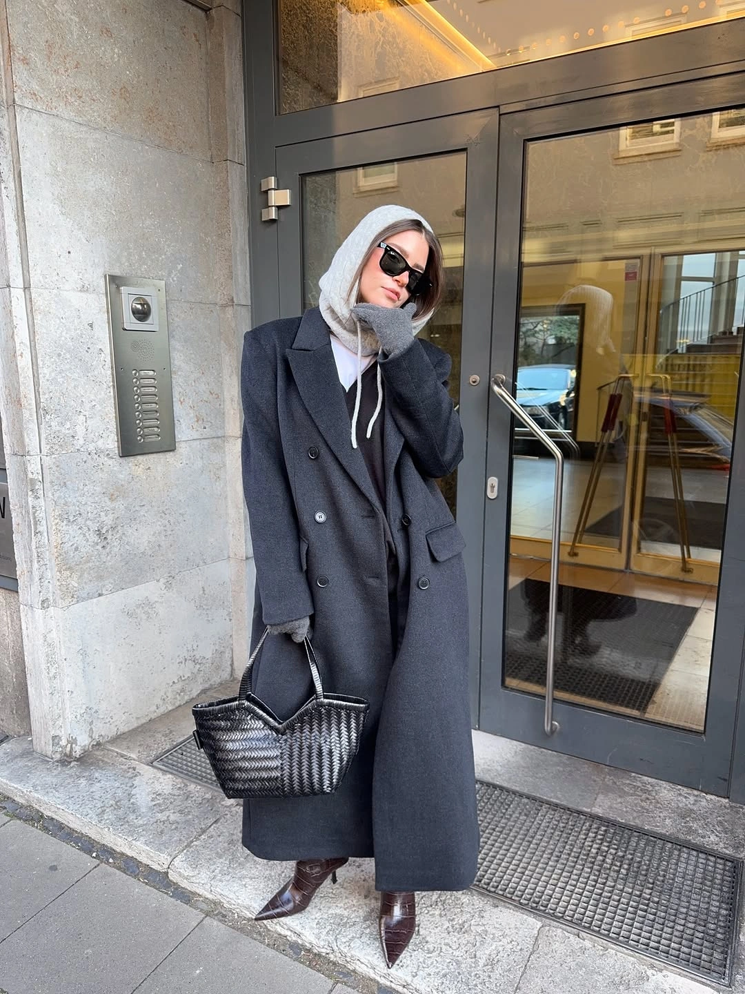 Charcoal coat with gray hooded layer and burgundy pointed boots