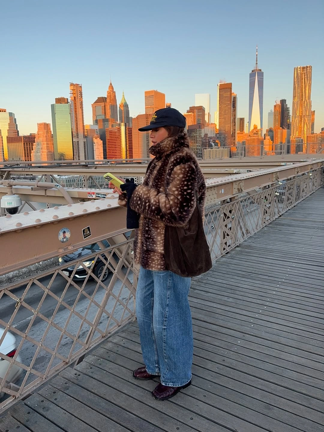 Spotted plush jacket with navy cap, jeans and burgundy shoes
