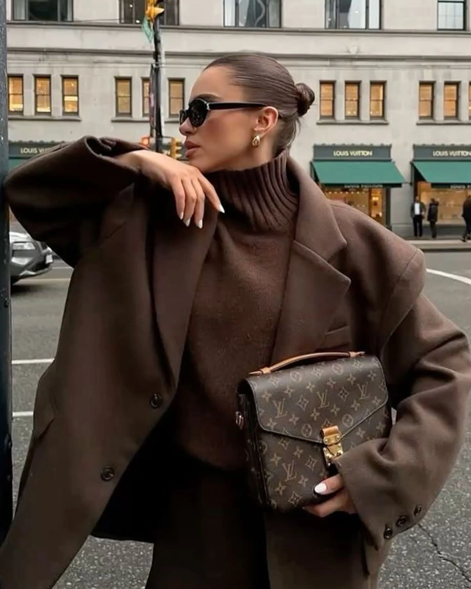 Oversized brown coat with turtleneck and structured bag