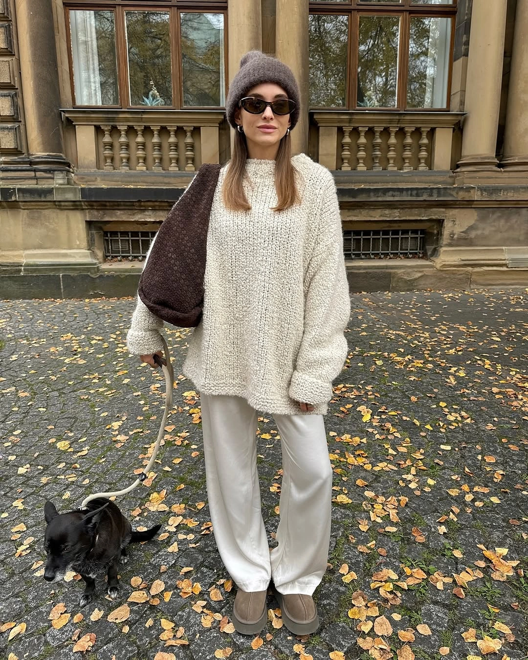 Cream sweater, white pants and taupe boots with gray beanie