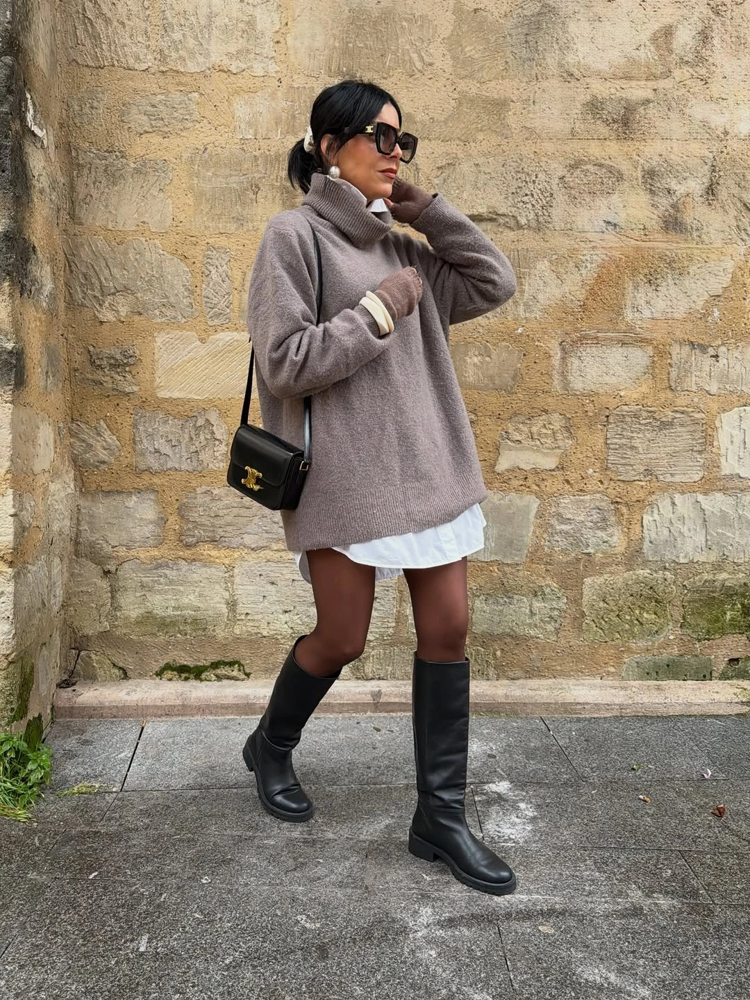 Taupe turtleneck sweater, white hem and black knee boots