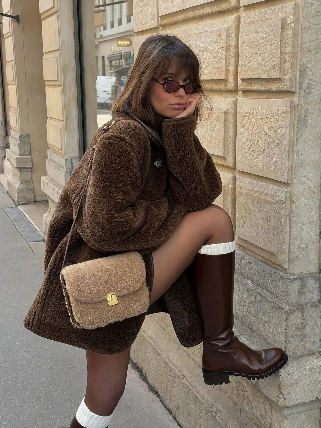 Chocolate plush coat, tall brown boots and white sock cuffs