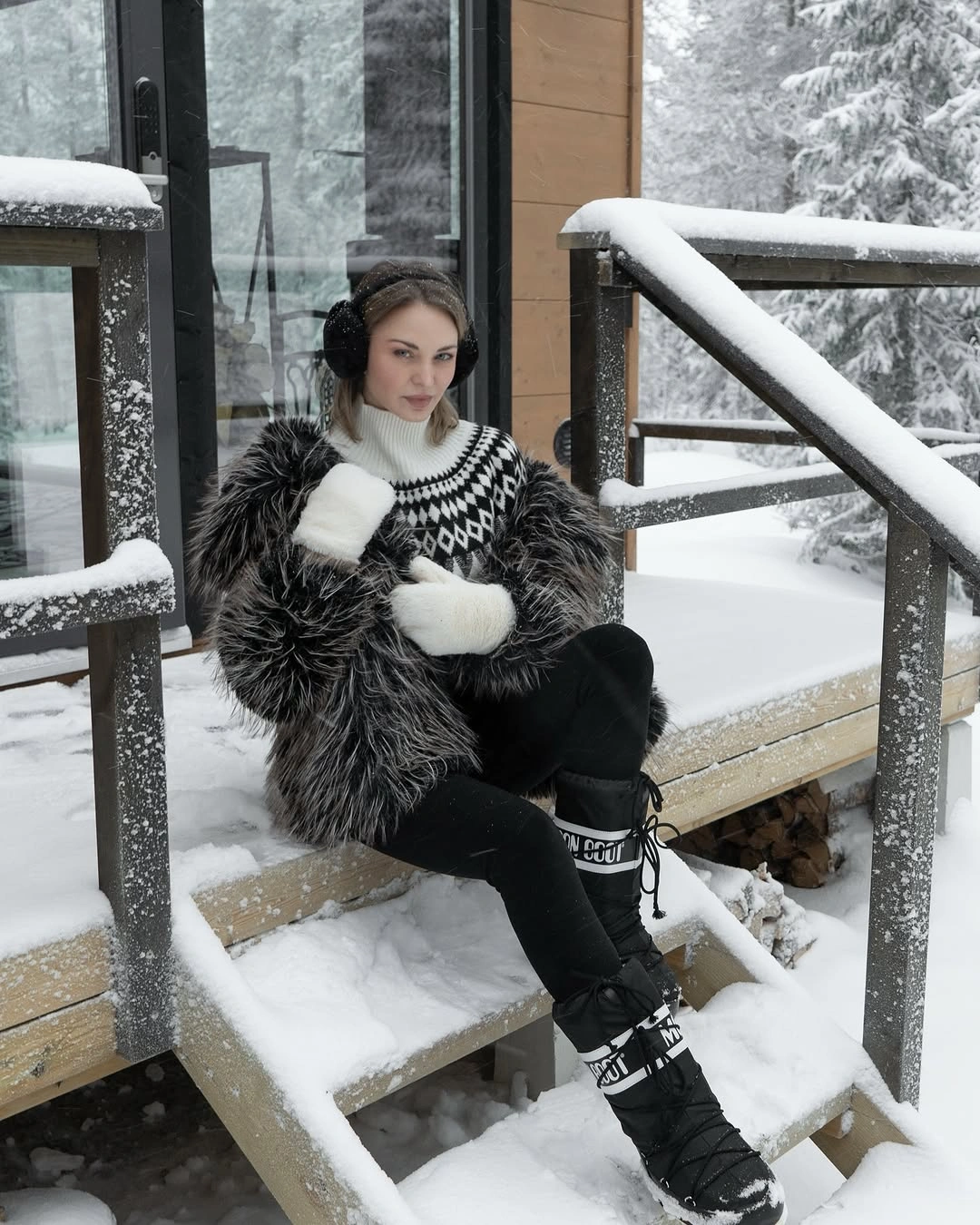 Patterned sweater, shaggy black jacket and lace-up snow boots